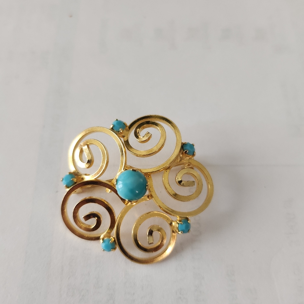 Austria gold tone brooch